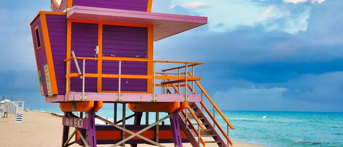 A colorful lifeguard tower on the sand at Miami Beach