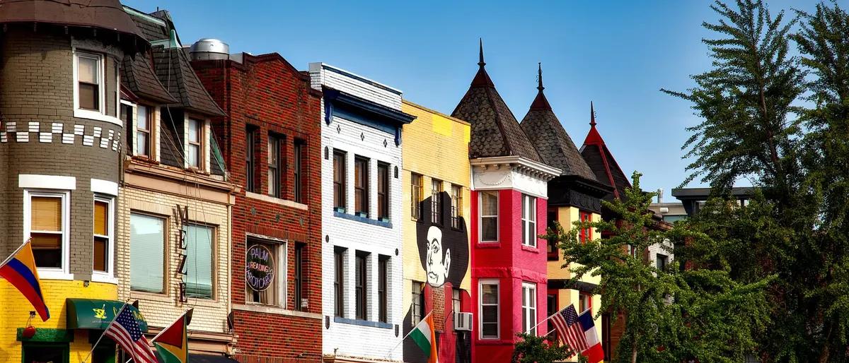 Colorful historic rowhouses with hanging flags in the Dupont Circle neighborhood of Washington, DC