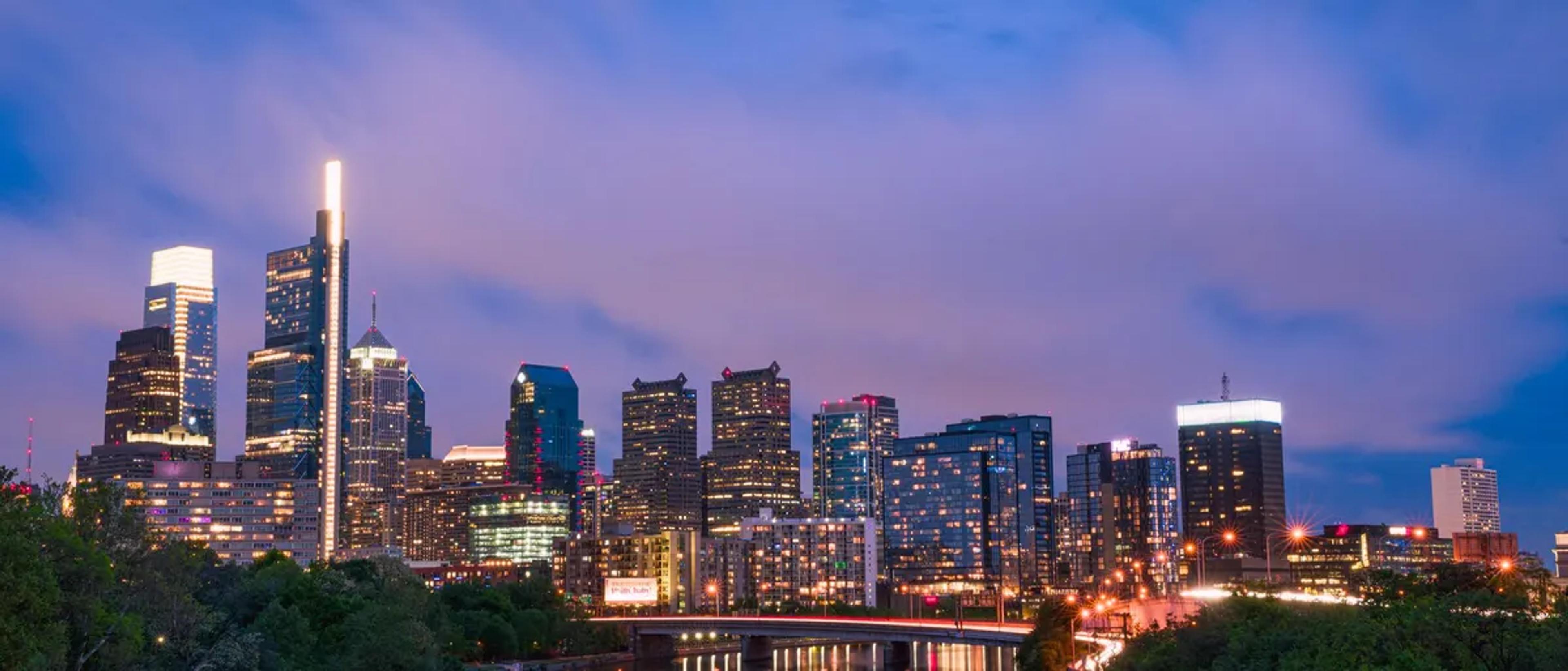 Philadelphia skyline against an evening sky