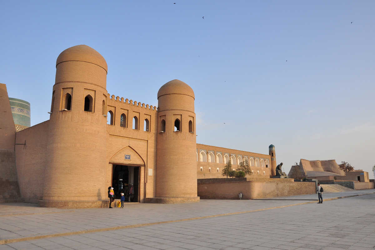 The historic Ata Darwaza gate in Khiva, Uzbekistan, a UNESCO landmark featuring distinctive twin mud-brick towers.