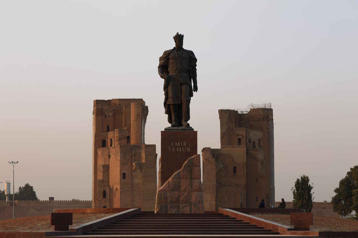 Amir Temur statue in front of the historic ruins of Ak-Saray Palace in Shakhrisabz, Uzbekistan.