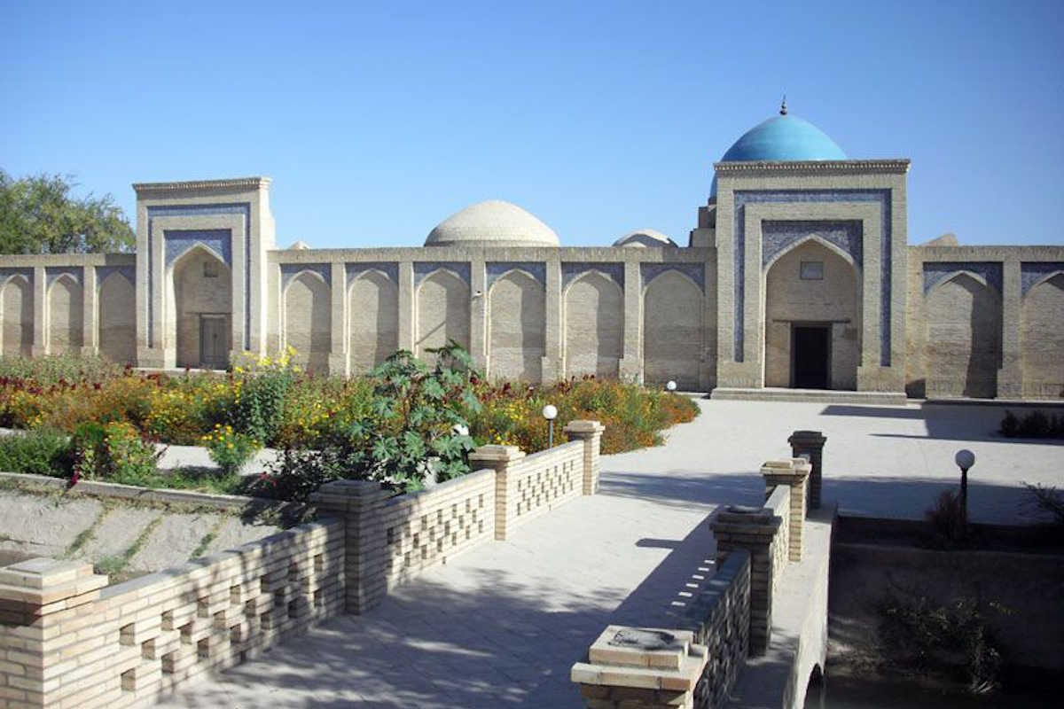 Said Muhammad Mahir Mausoleum in Khiva, Uzbekistan: Historic landmark with blue dome and garden.