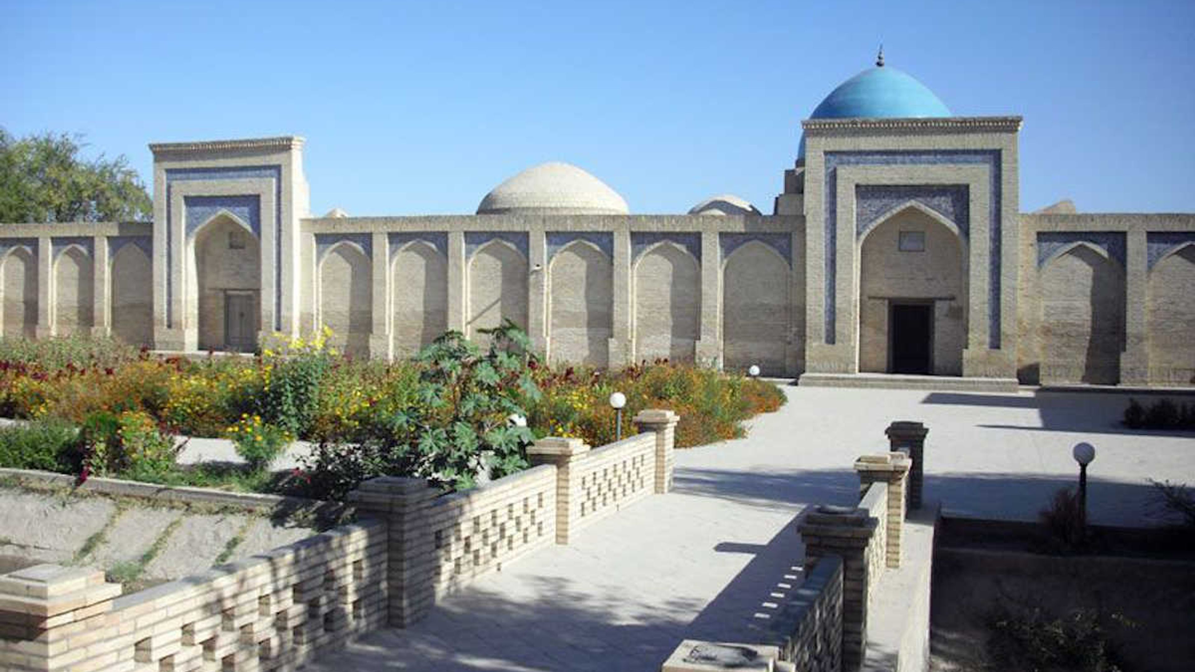 Said Muhammad Mahir Mausoleum in Khiva, Uzbekistan: Historic landmark with blue dome and garden.