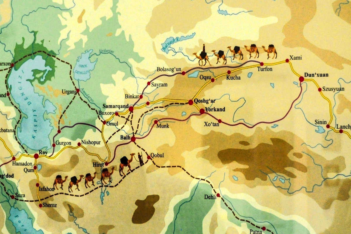 Historical map of the Great Silk Road in Central Asia showing trade routes, cities, and camel caravans.