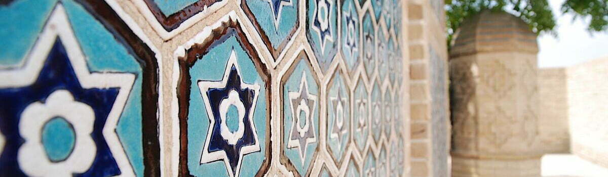 Blue and white tile mosaics with geometric patterns in Termez, Uzbekistan – Silk Road architecture