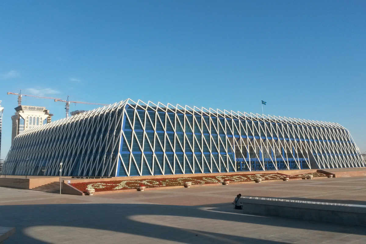 Palace of Independence in Astana, Kazakhstan – modern architecture and popular tourist attraction under a clear blue sky.