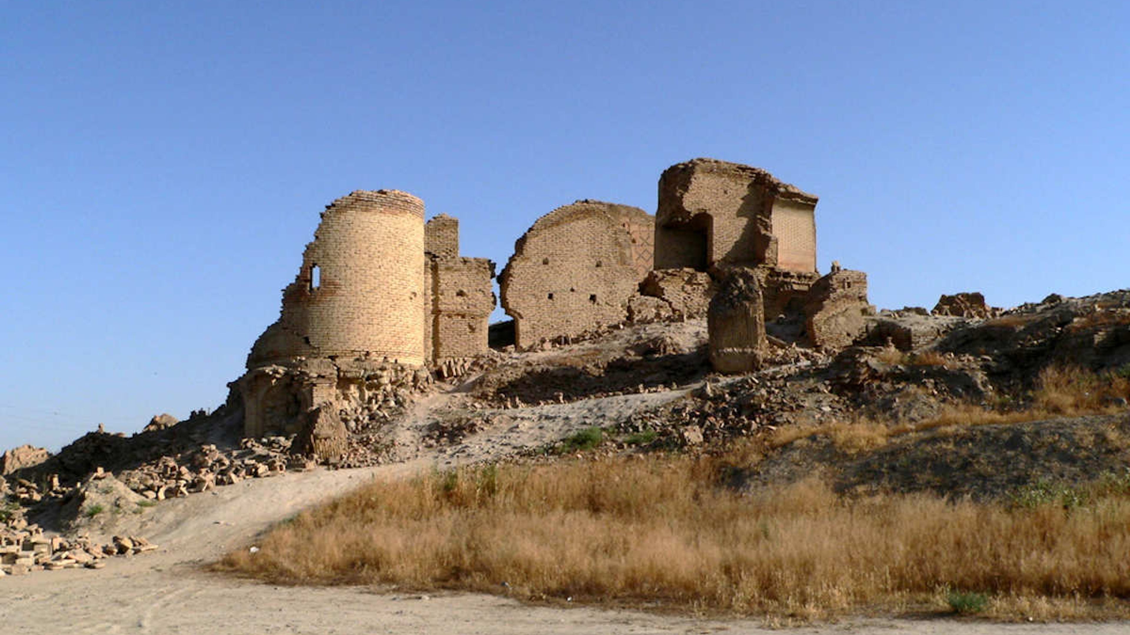Anau settlement attraction near Ashgabat, Turkmenistan: Historic ancient ruins under a clear blue sky.