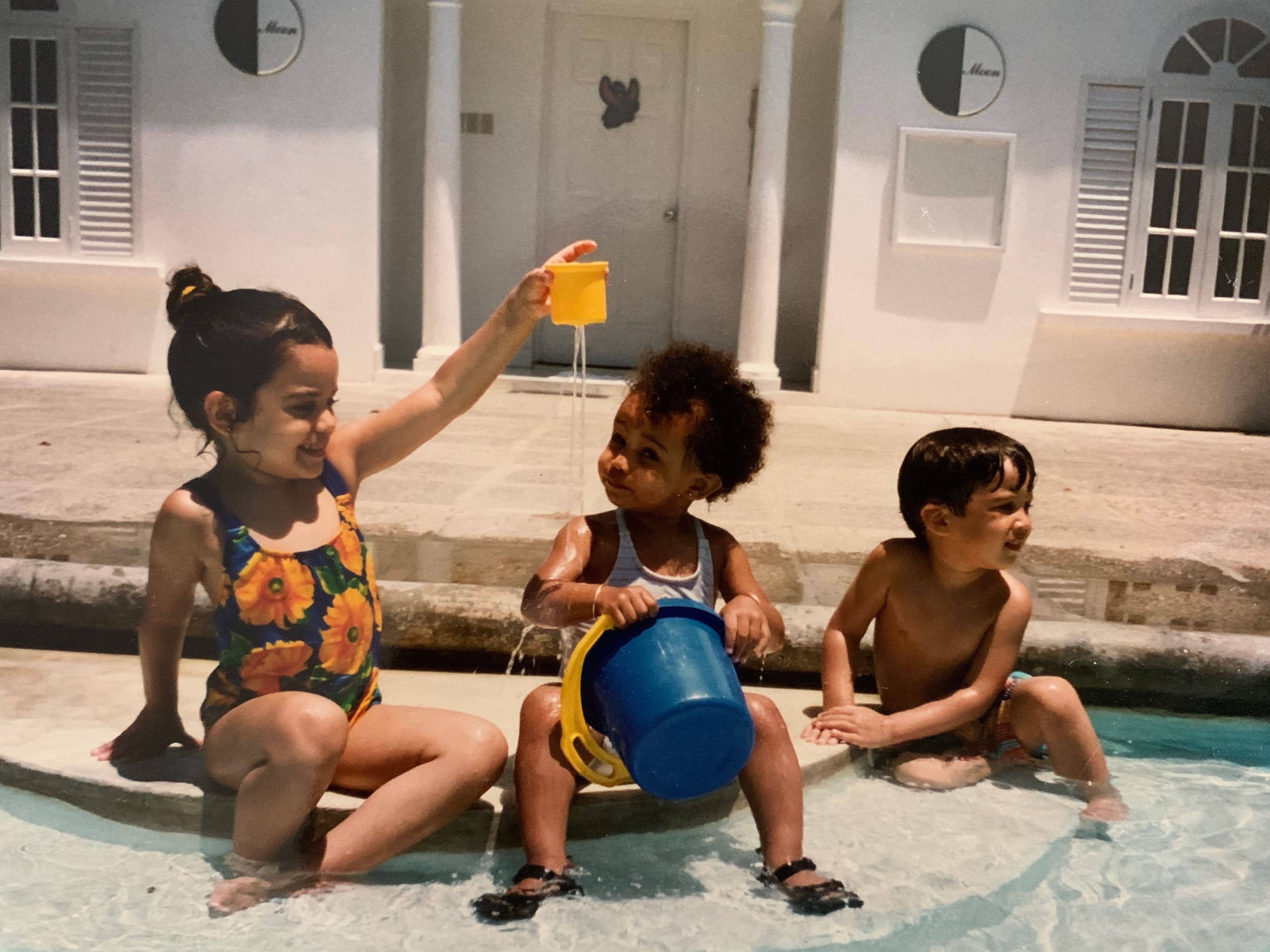 Deandra and cousins playing in the pool at Half Moon. 1996, Jamaica.