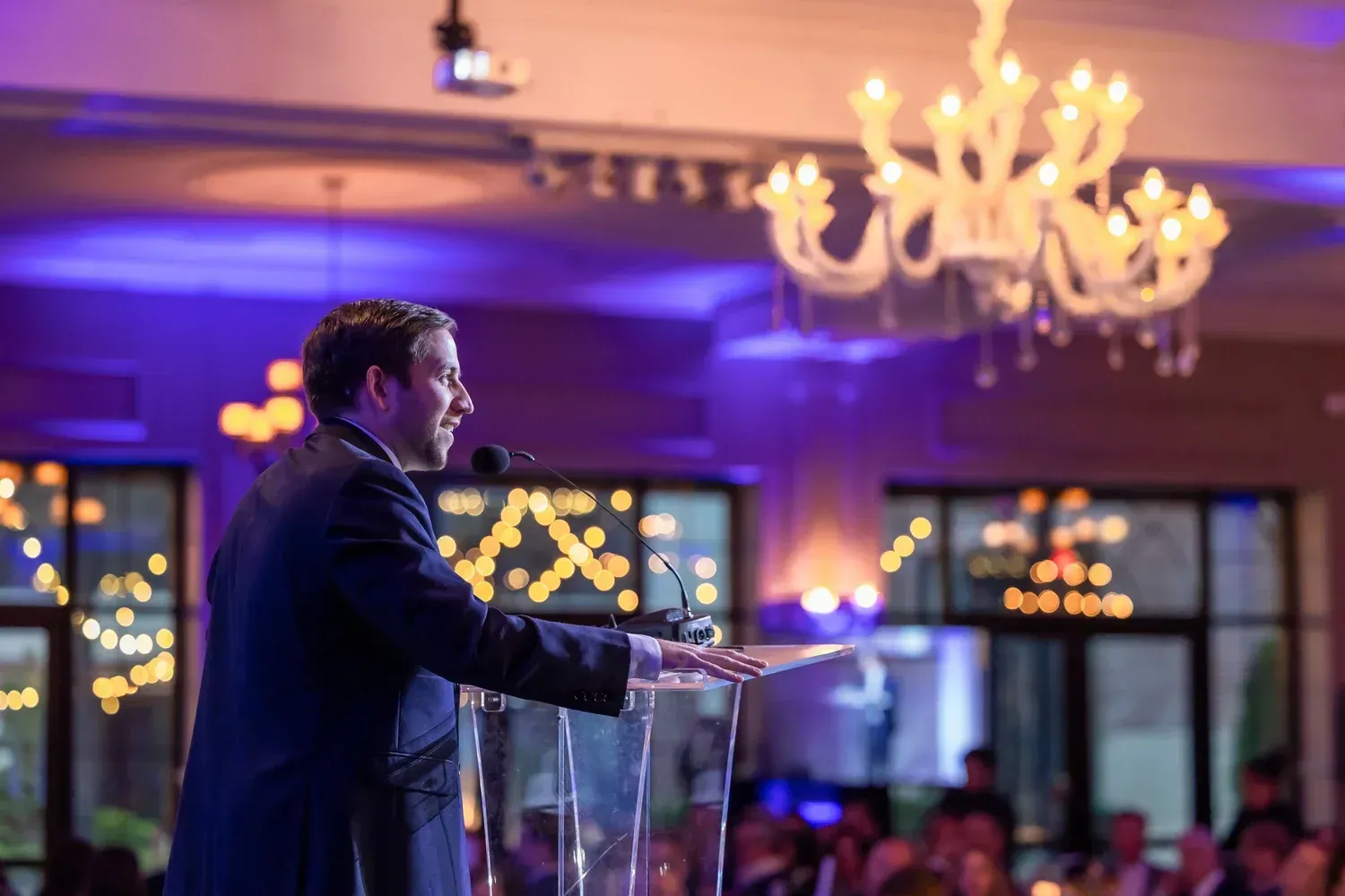 A speaker addressing guests from the podium at the Gala of Hope.