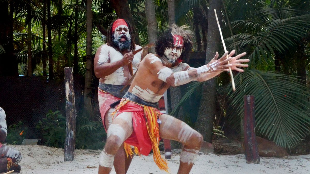 Group of Yugambeh Aboriginal warriors dance during Aboriginal culture show in Queensland, Australia.