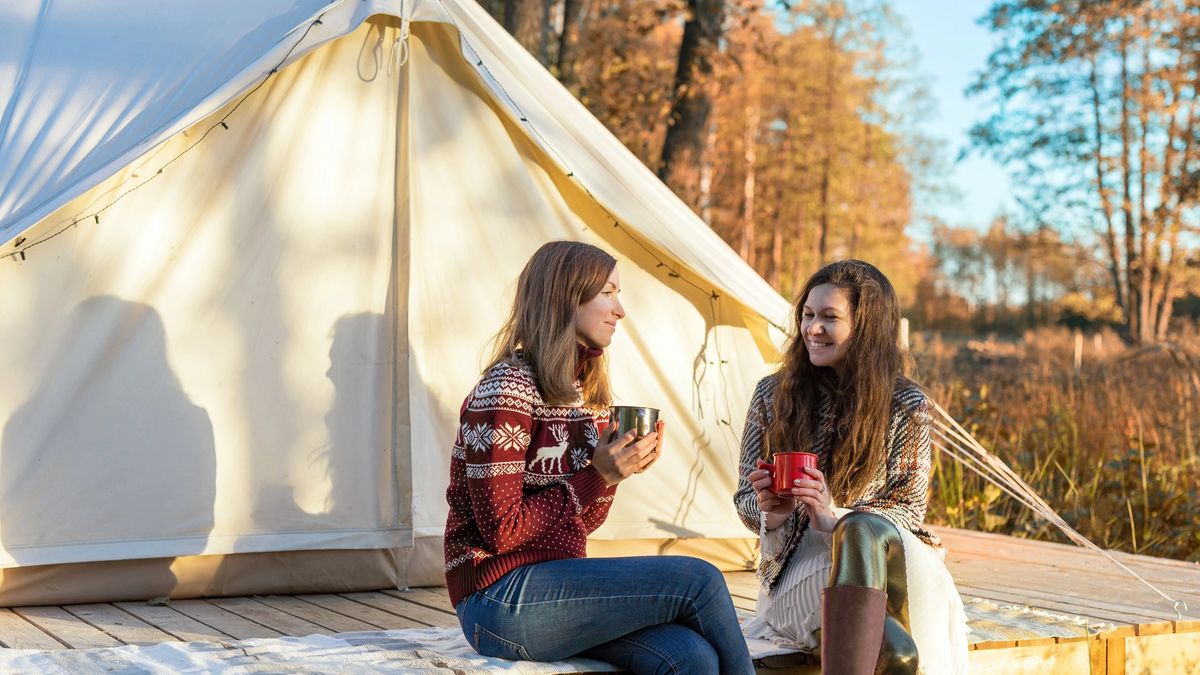 Two women prepared to enjoy a well deserved glamping trip
