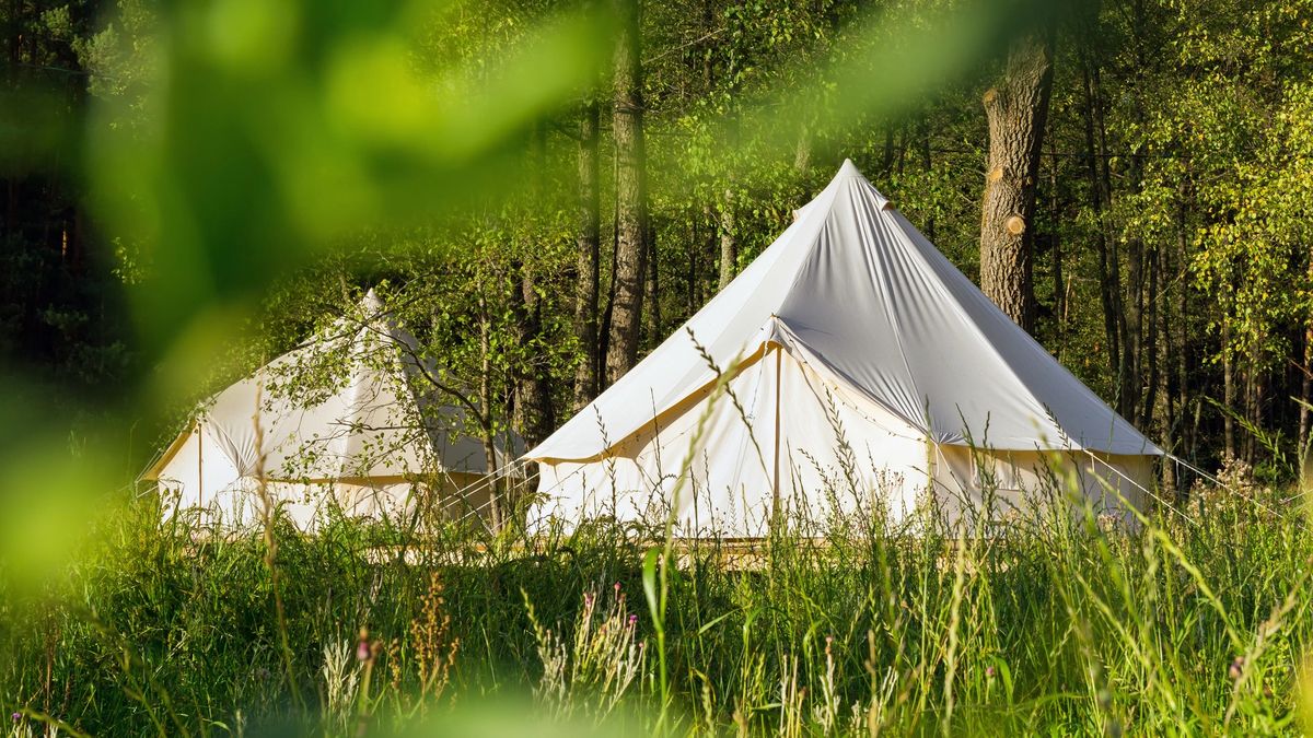 A canvas tents and a semi permanent deck often used for glamping