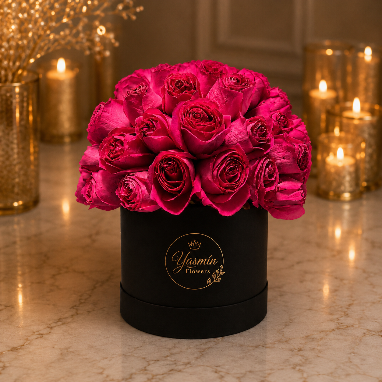 Un elegante arreglo de 50 rosas rosadas en una sofisticada caja negra