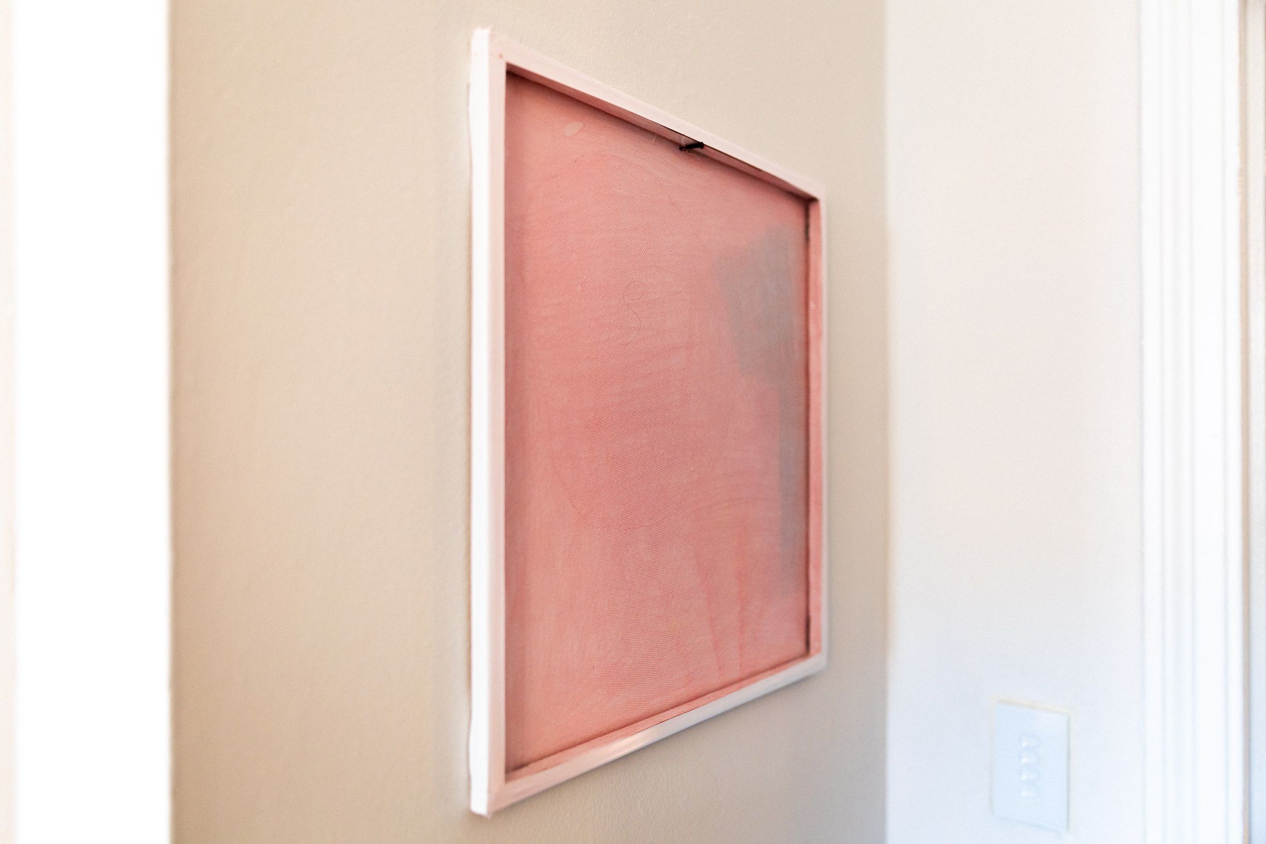 The net painting at an angle, light passing through the stretched fabric.