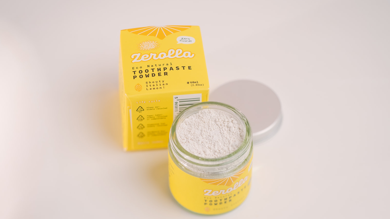 A yellow jar of Zerolla toothpaste powder