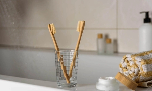 toothbrushes on a glass