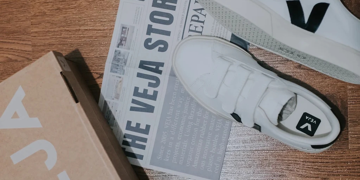 A pair of white Veja shoes