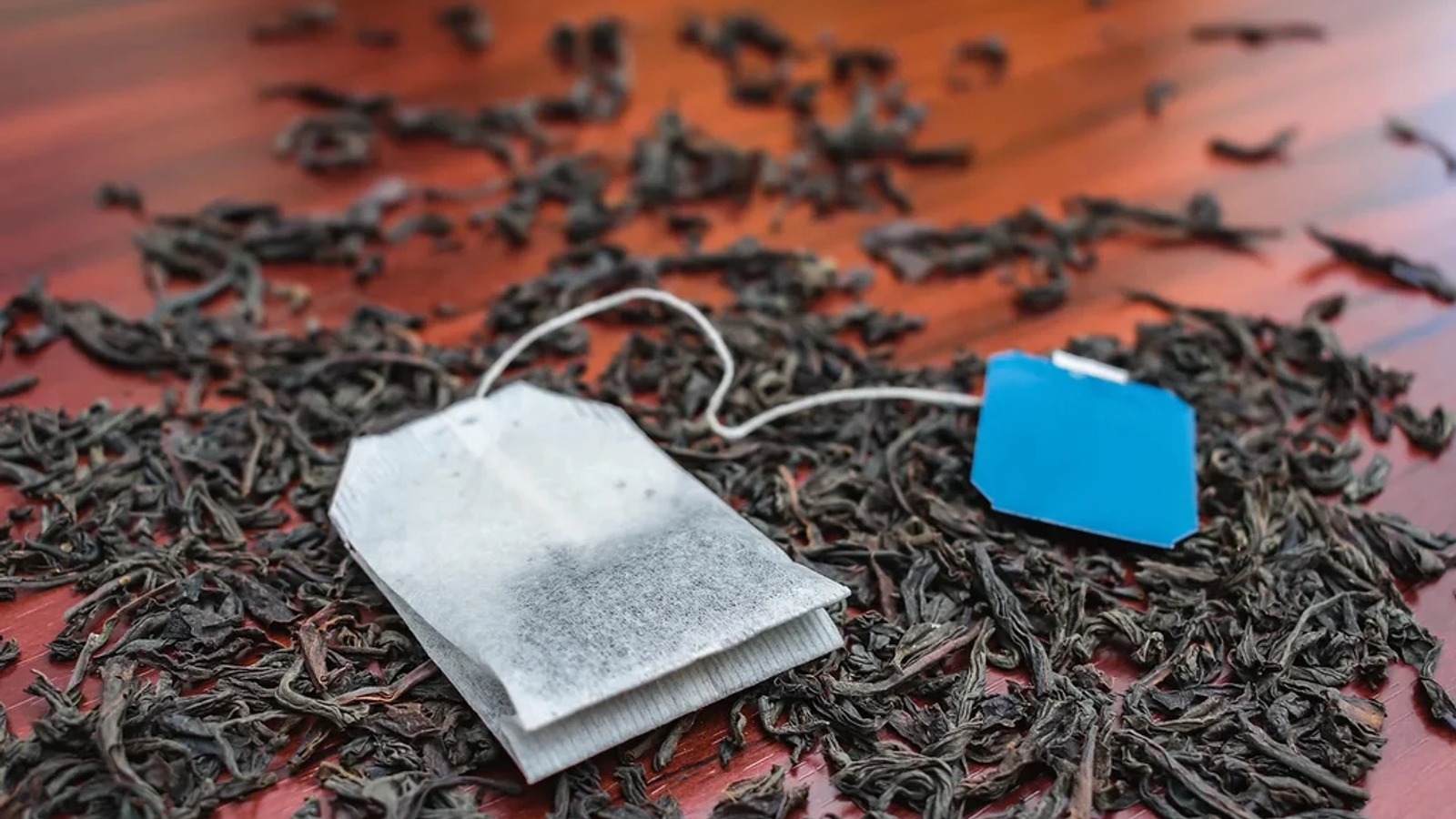 Teabag on some leaves on a table