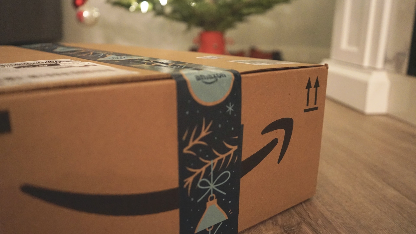 Amazon box next to Christmas tree