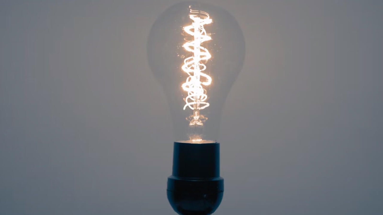 A lightbulb on a grey background