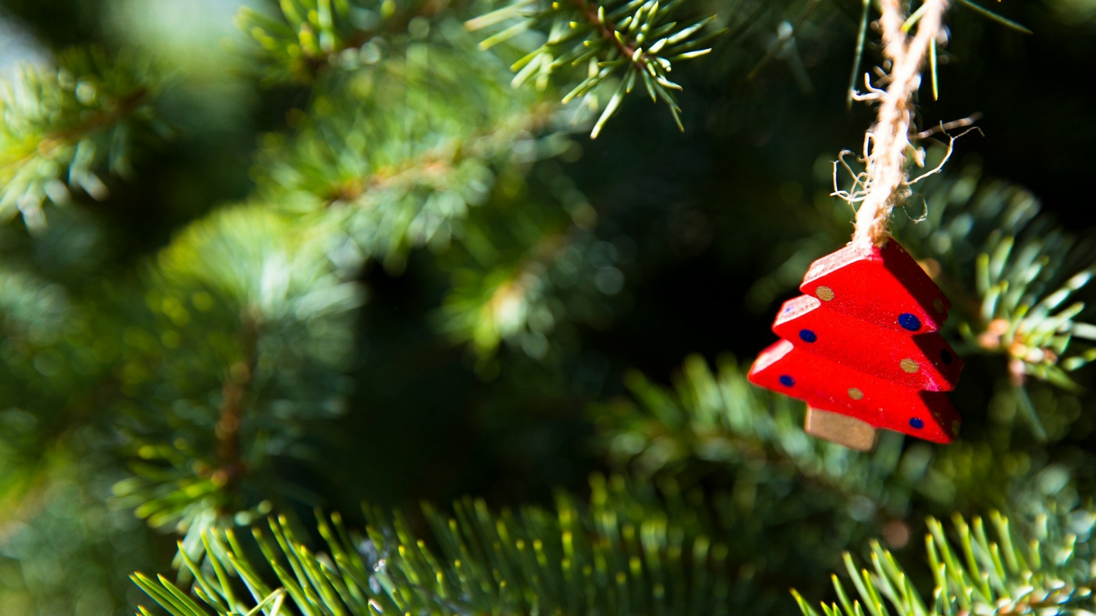 A small red wooden christmas tree decoration