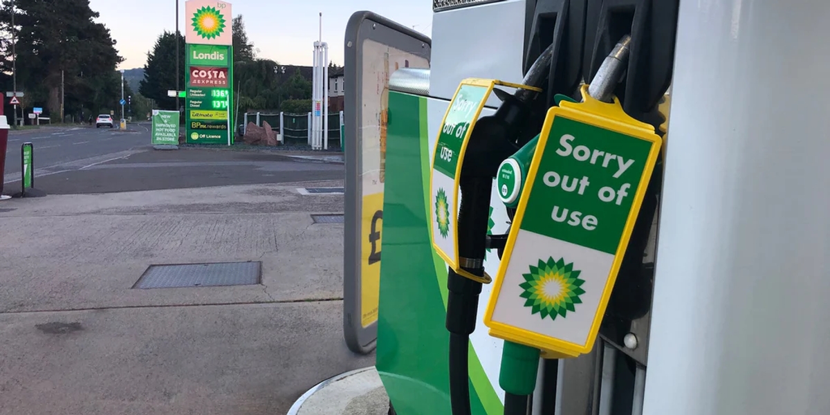 A closeup of a BP gas or petrol pump with a 'Sorry out of use' sign