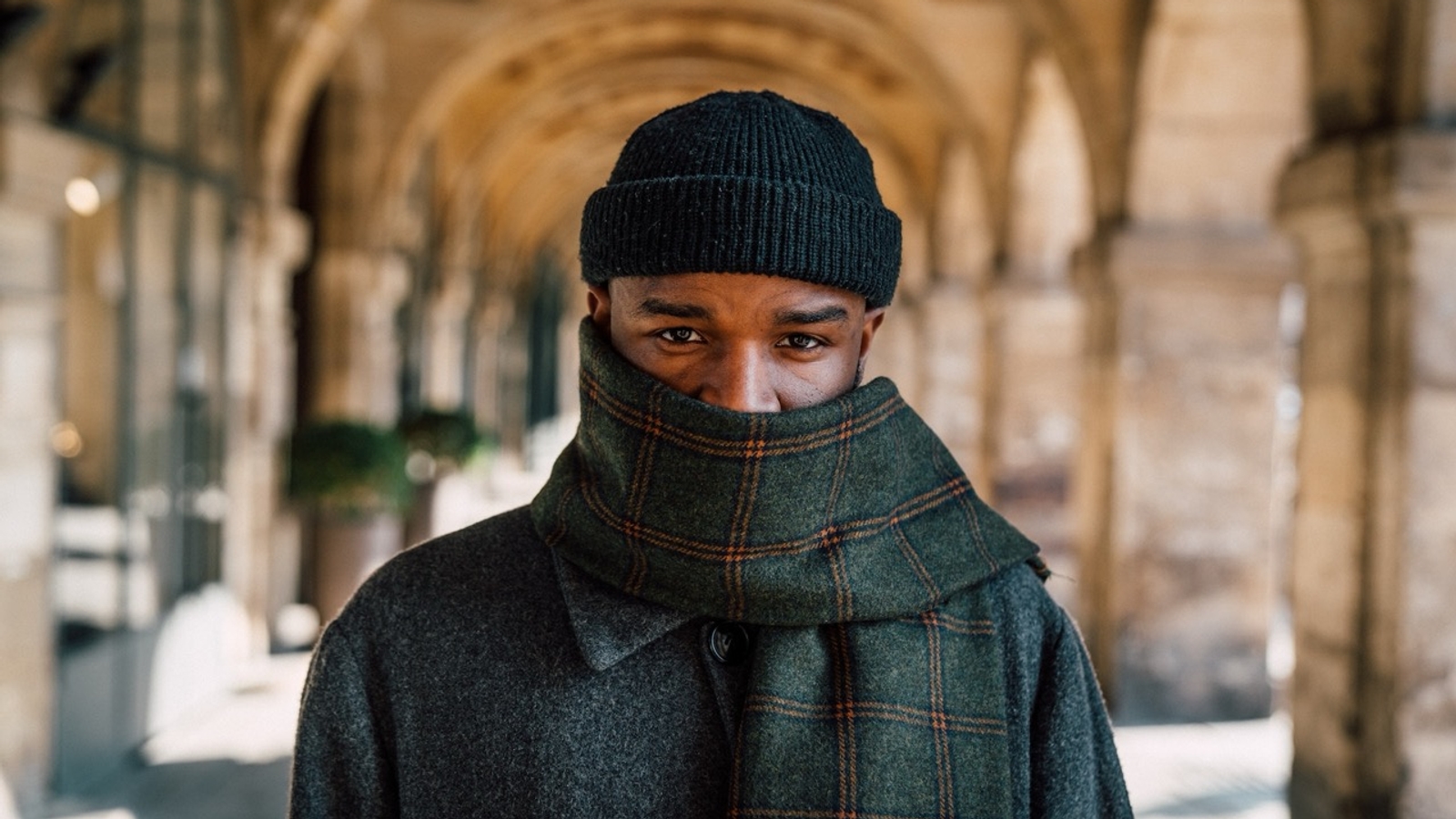 Man wearing a scarf and a beanie