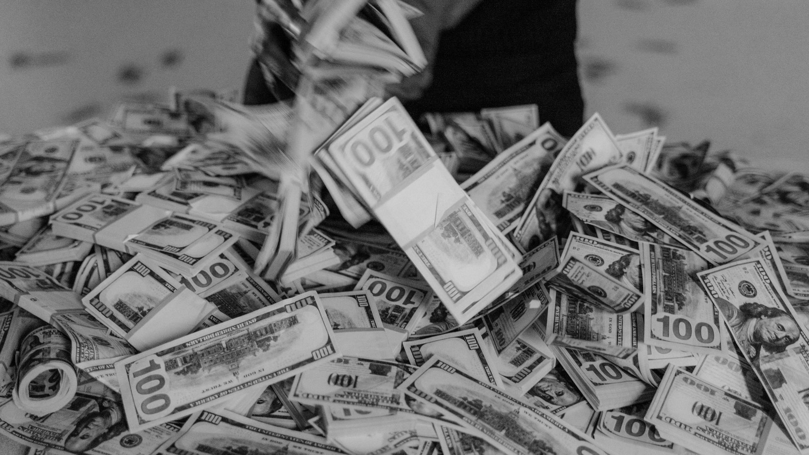 Black and white photo of pile of dollars