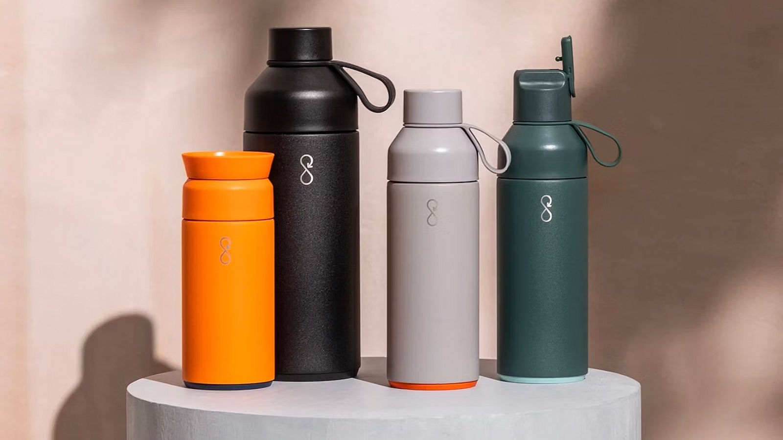 A group of Ocean Bottle reusable coffee cups and bottles