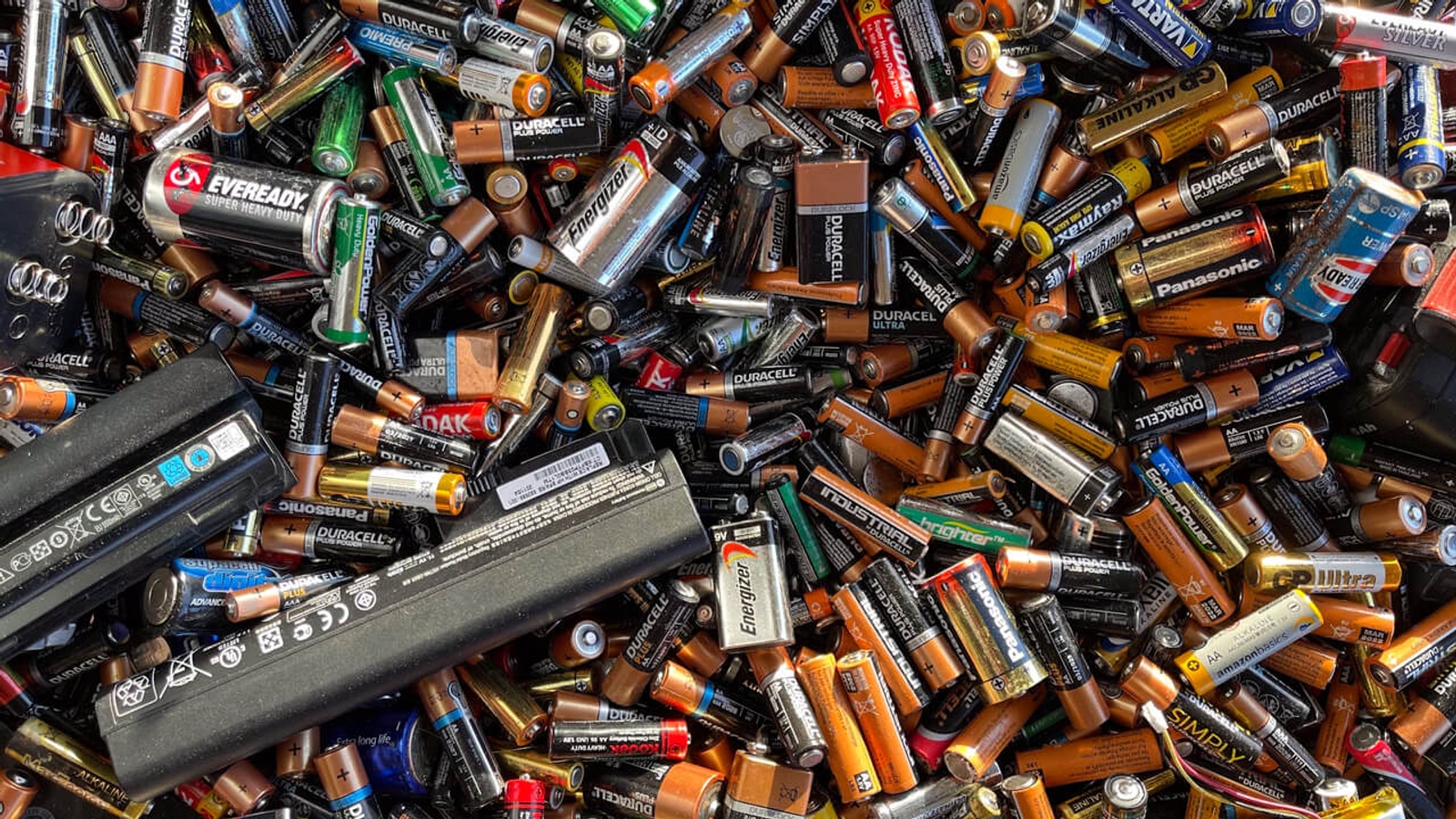 A pile of old used batteries