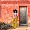 Emma Slade Edmondson standing in front of a red building