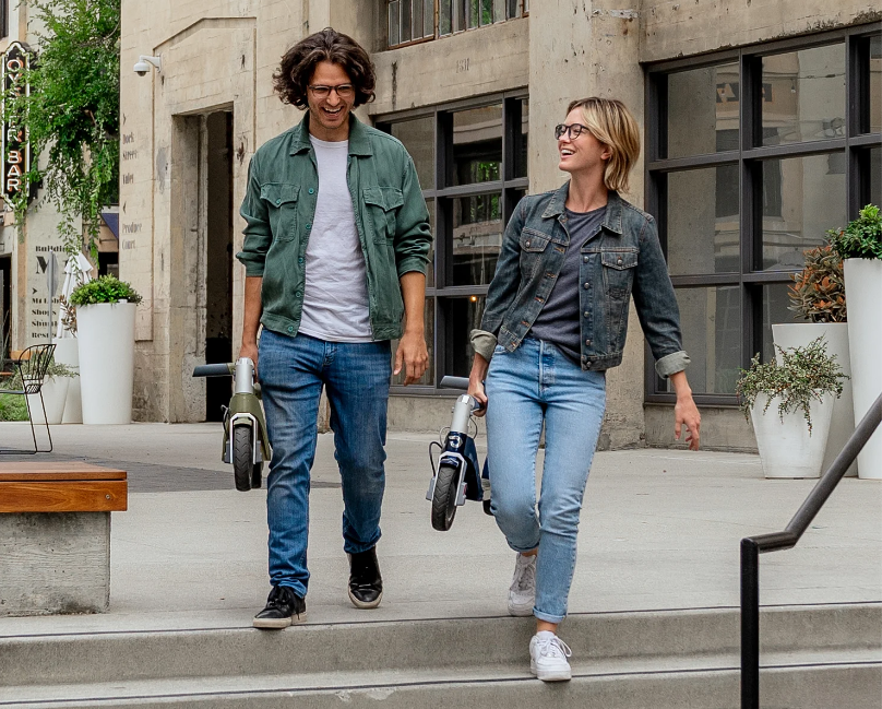 a couple with electric scooters
