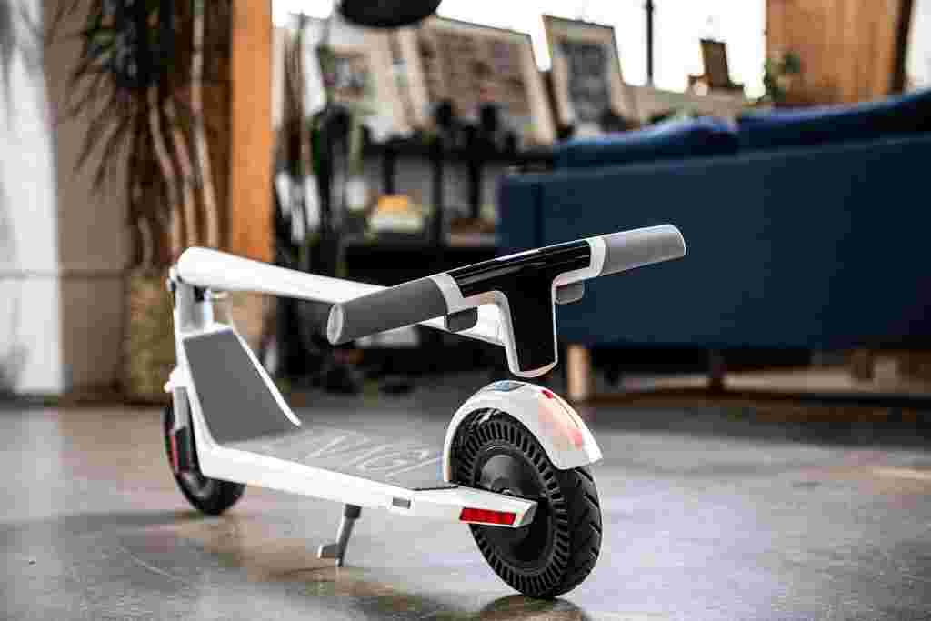 Electric scooter indoor lifestyle white Unagi