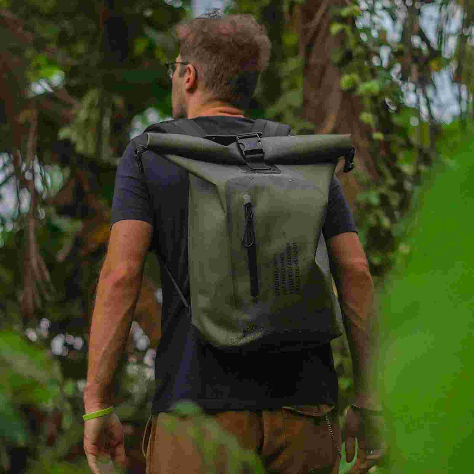 Man hiking with waterproof bag