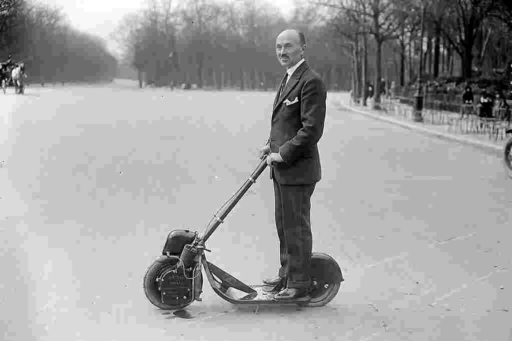 historical picture of man on autoped