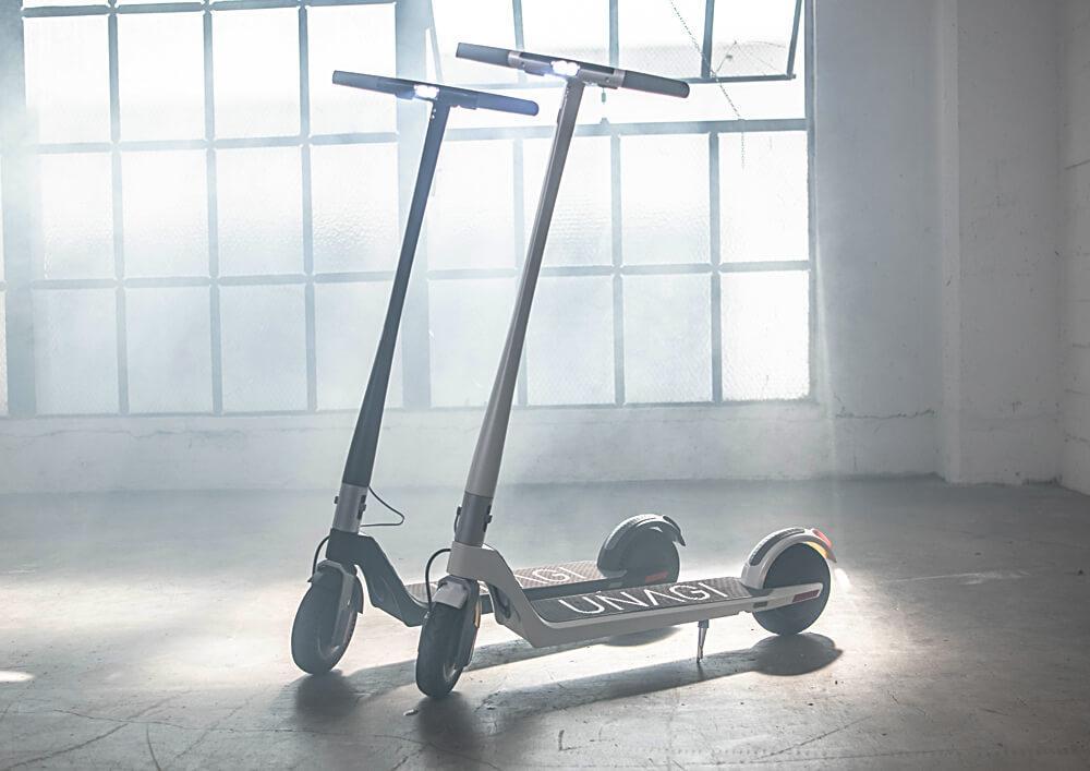Two electronic scooters in warehouse