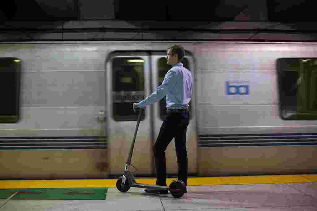 BART subway transit electric scooter rider