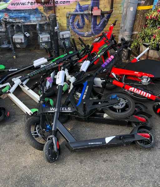 junk pile of shared scooters