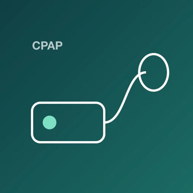 A CPAP machine with a hose running to a mask