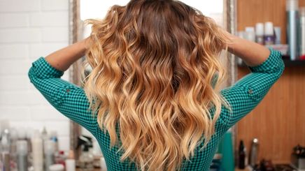 Girl with brown to blonde ombre hair