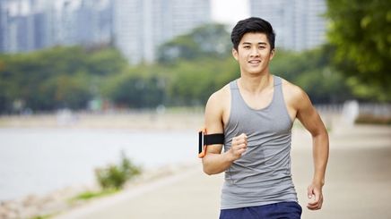 Young Asian man jogging