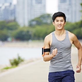 Young Asian man jogging