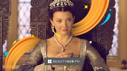 Anne Boleyn in The Tudors wearing crown and sitting on a throne.  
