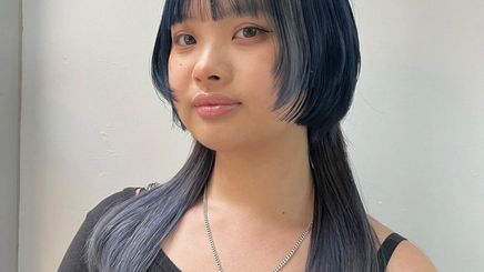 Woman with blue jellyfish haircut. 
