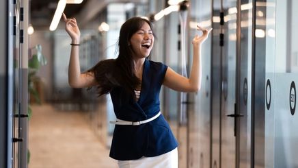 Asian woman happy and confident at the office