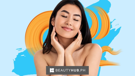 A beautiful Asian woman with eyes closed and hands on her chin