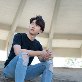 Korean young man in a black shirt and jeans