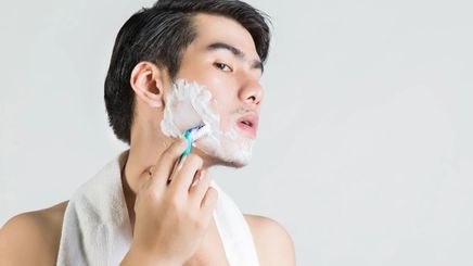 Man putting on shaving cream