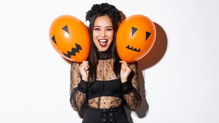Asian girl in Halloween costume and makeup