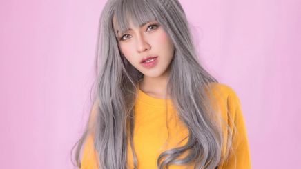Asian woman with gray colored hair